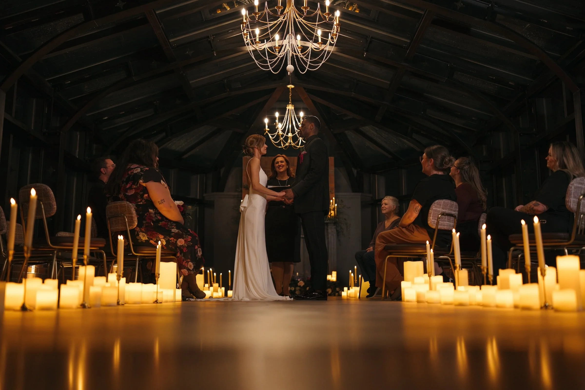 candle lit wedding ceremony in a glass rooftop room