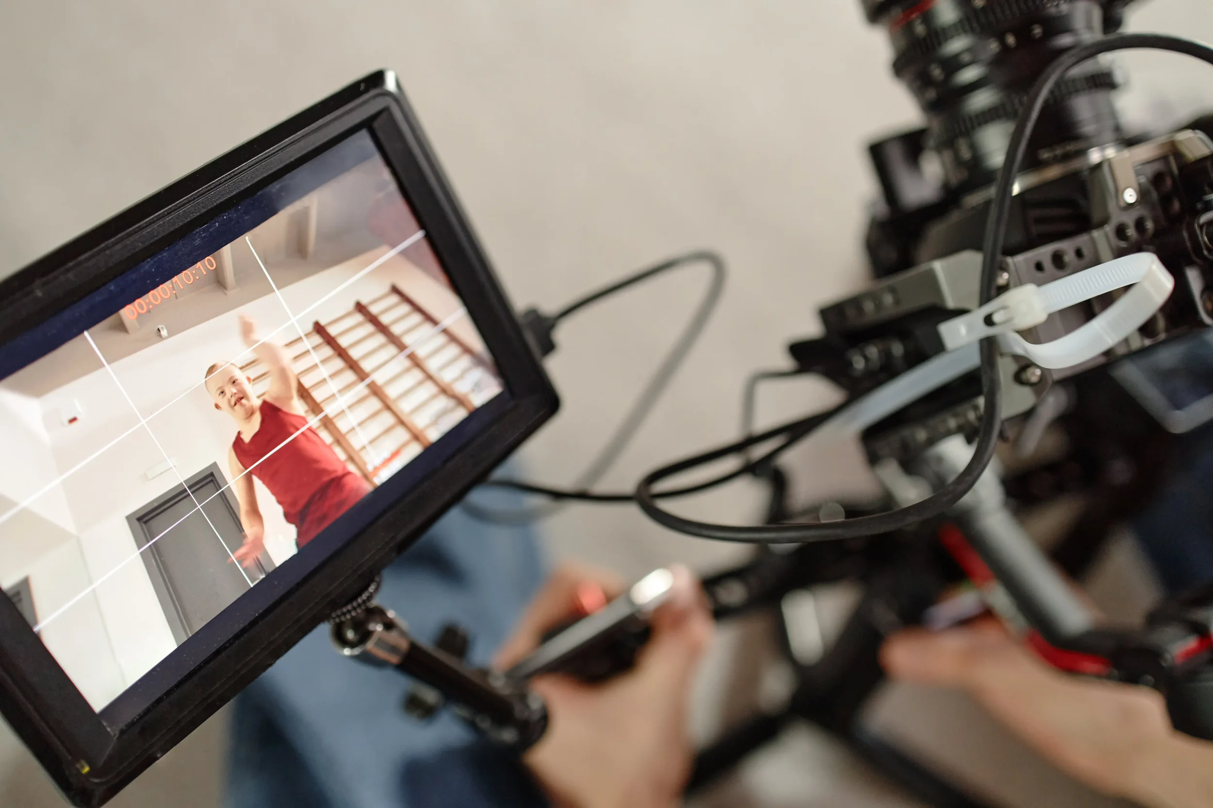 Camera monitor showing a child participating in a community education program during video production