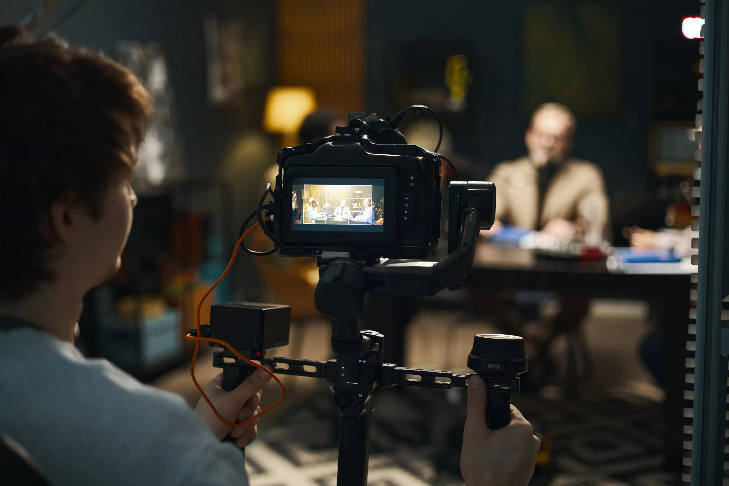 Camera operator filming a professional interview for a purpose-driven organisation on the Gold Coast