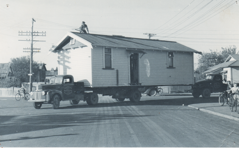 the-rear-is-supported-by-the-trusty-GMC-Note-the-fellow-on-the-roof-with-his-insulated-stick-to-lift-the-power-lines-dressed-neatly-in-his-hat-and-tie.png