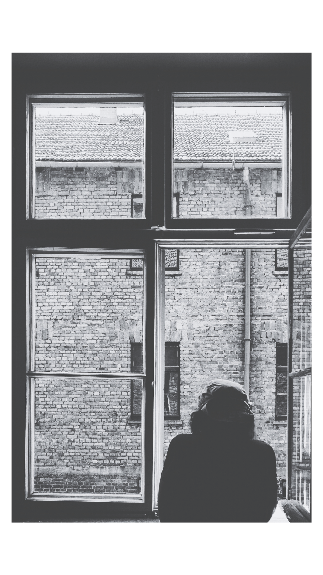 Person in a window at Kai Innovations, Kai Kreative Co