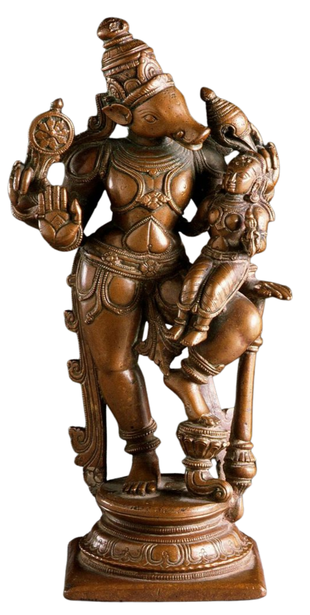 Wooden sculpture of Lord Krishna playing flute, standing on a decorated platform, with detailed jewelry and a patterned headpiece.