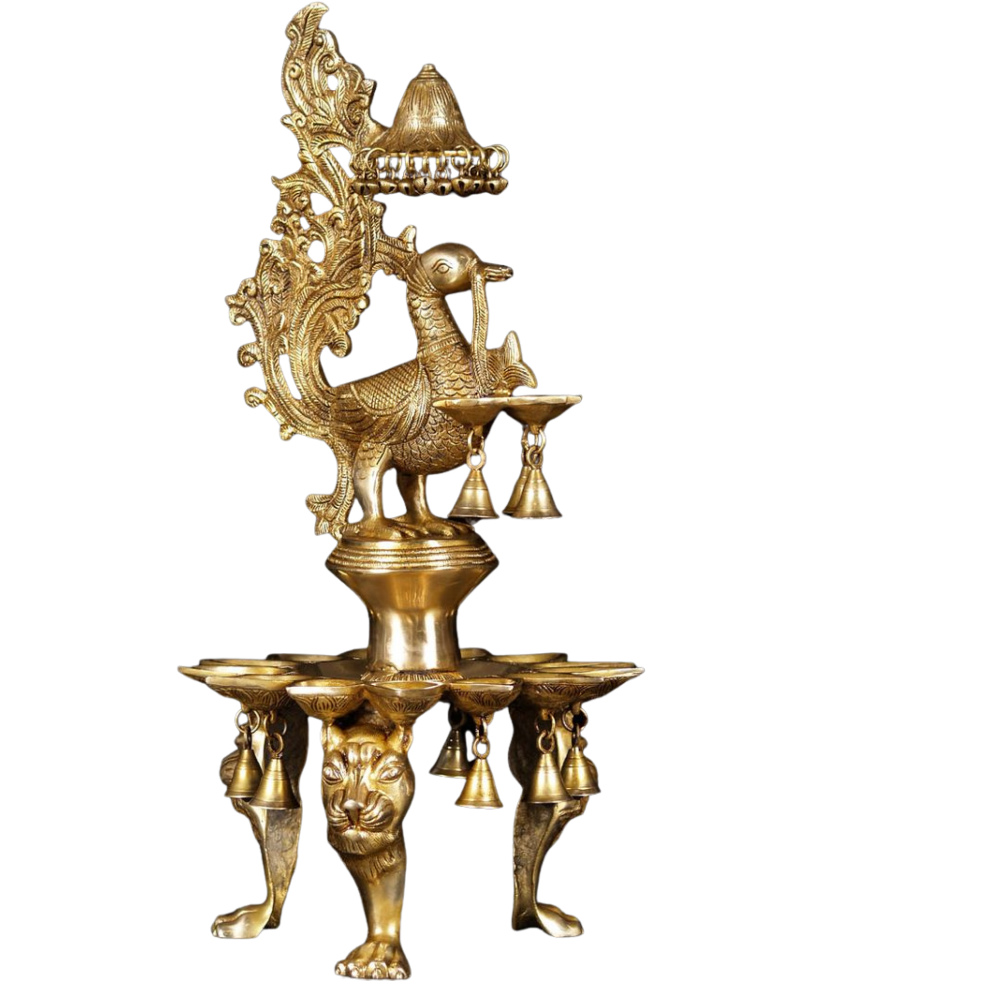 Gold decorative wall hanging and table with mythical lion, peacock, and floral motifs with a lamp on top, ornate base with hanging bells.