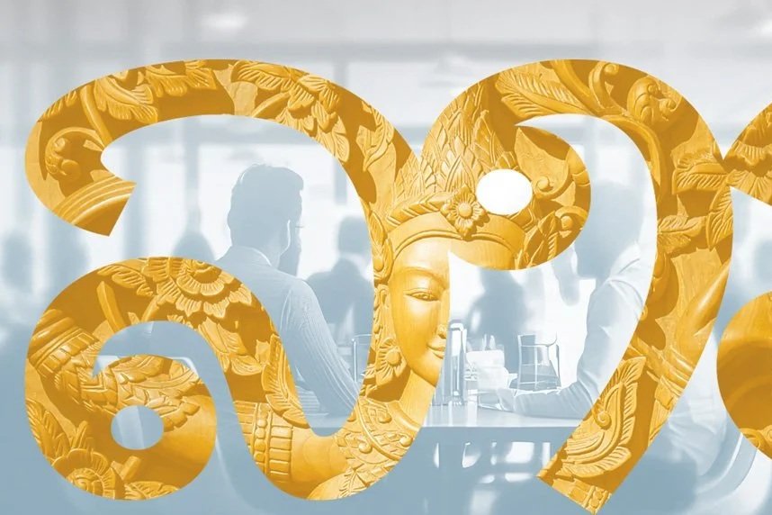 A transparent overlay of golden ornate, traditional Asian artwork with a serene female face, on top of a blurred business meeting scene with people around a table.