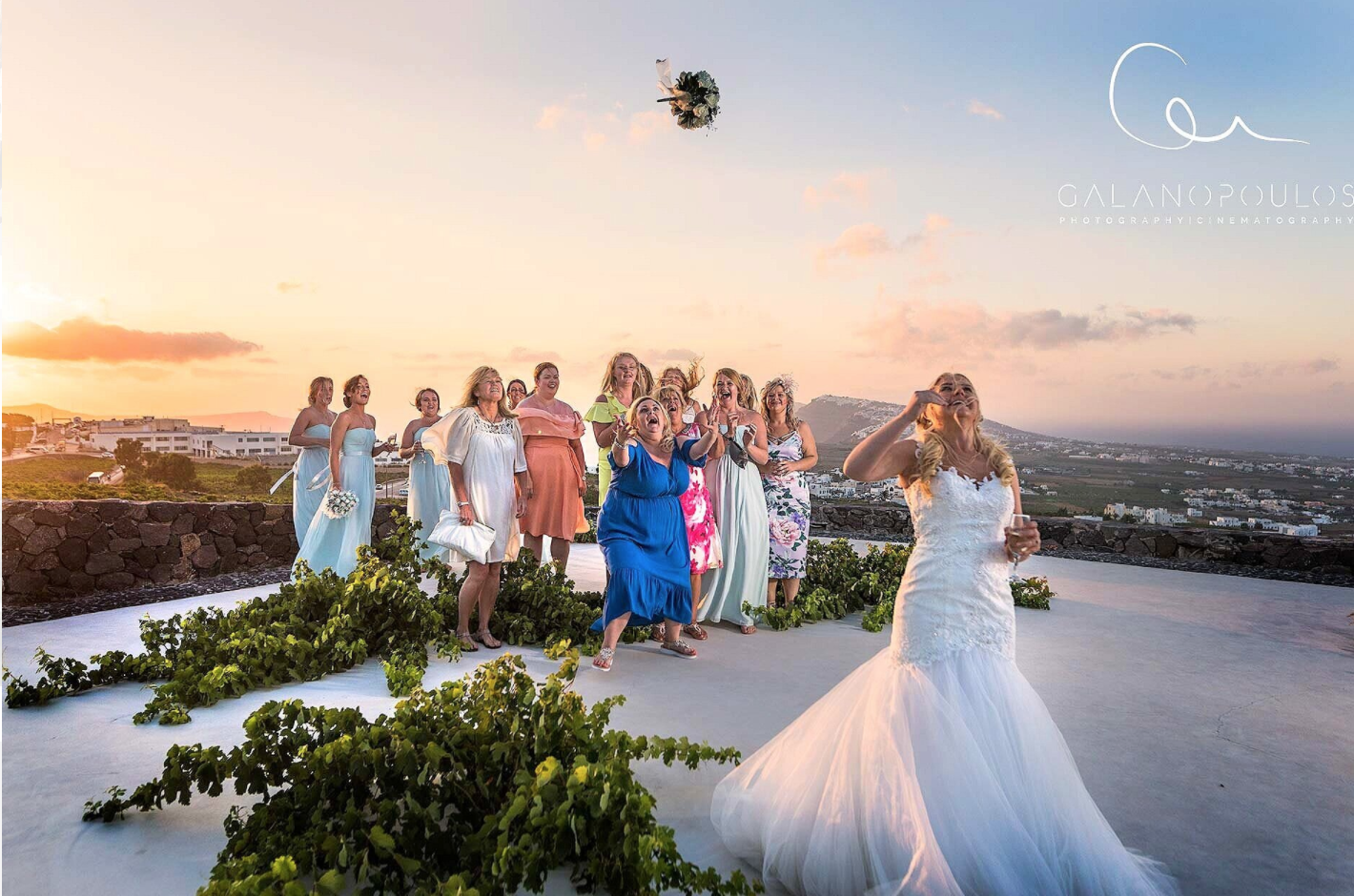 Santorini wedding photography portrait at Pyrgos castle ruins with medieval textures, arched frames and soft directional late‑afternoon light.