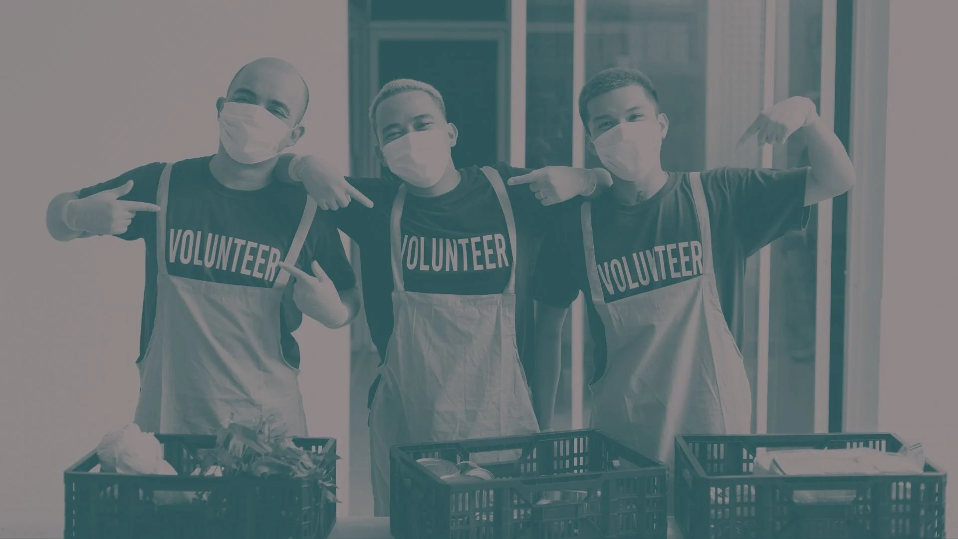 Volunteers at a community event smiling.