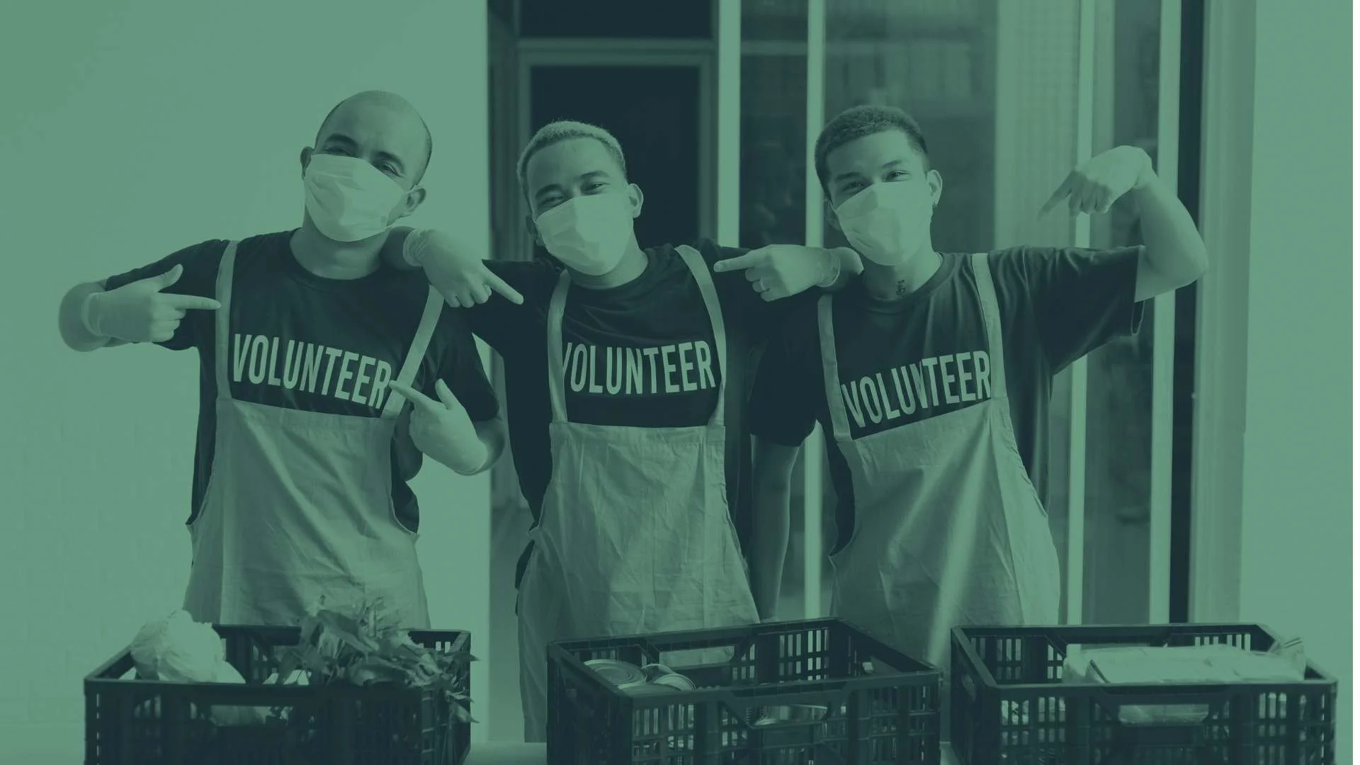 Volunteers at a community event smiling.