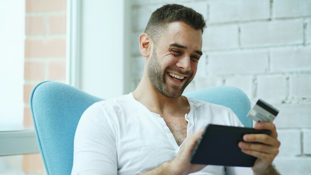 Man in white shirt engaged in online therapy from Cambridge, MA