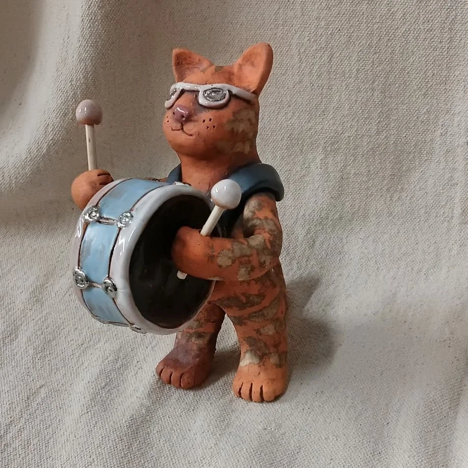 Cool cat drummer, red earthenware clay, fired to cone 05 with gold luster