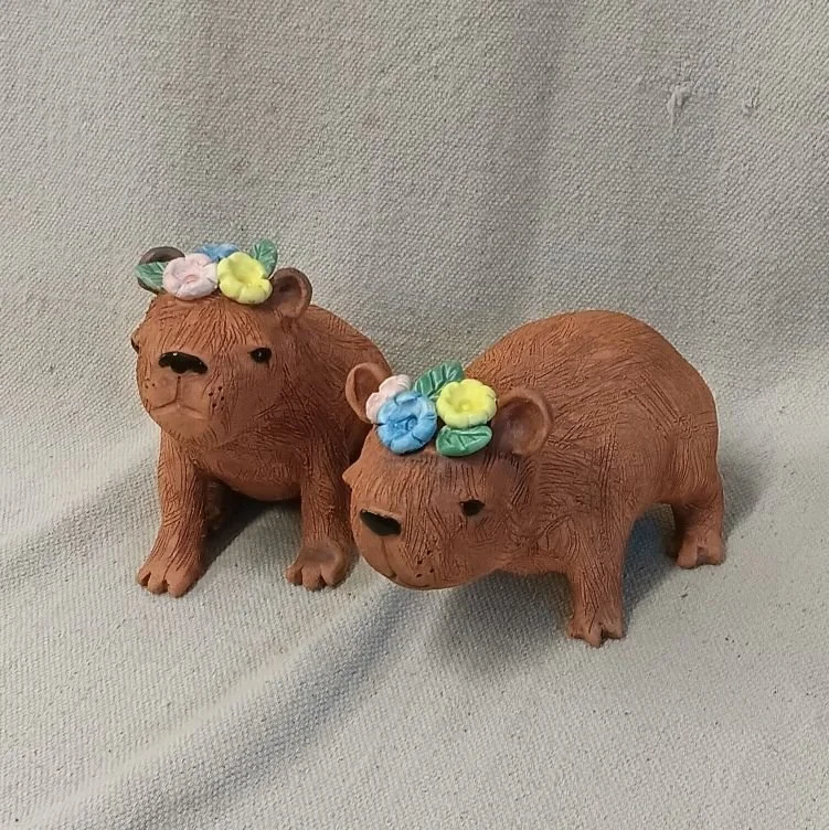 Flowered capybara, red and white earthenware clay, fired to cone 05