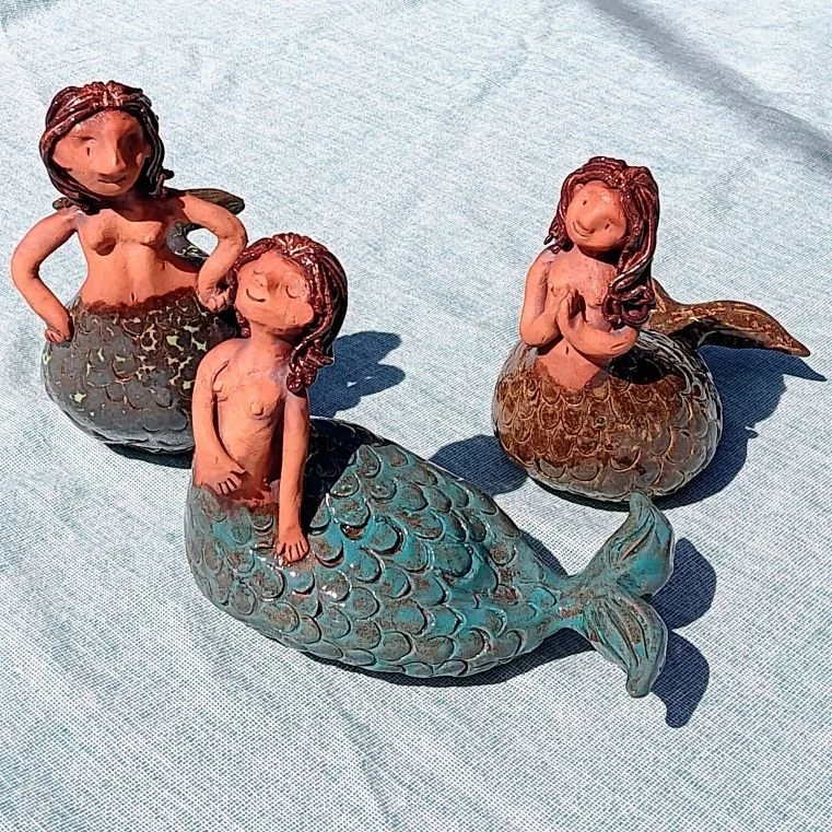 | 2 are sold, one available| 3 mermaids, red earthenware clay, fired to cone 05