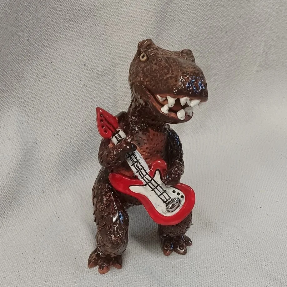 T HendRex, white and red earthenware clay, fired to cone 05 with white gold luster (on display at Commonwheel Gallery, Holiday market, Nov-Dec 2026)