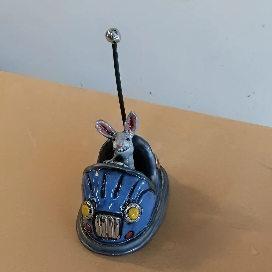 Bumper car rabbit, white earthenware clay, fired to cone 05, white gold luster