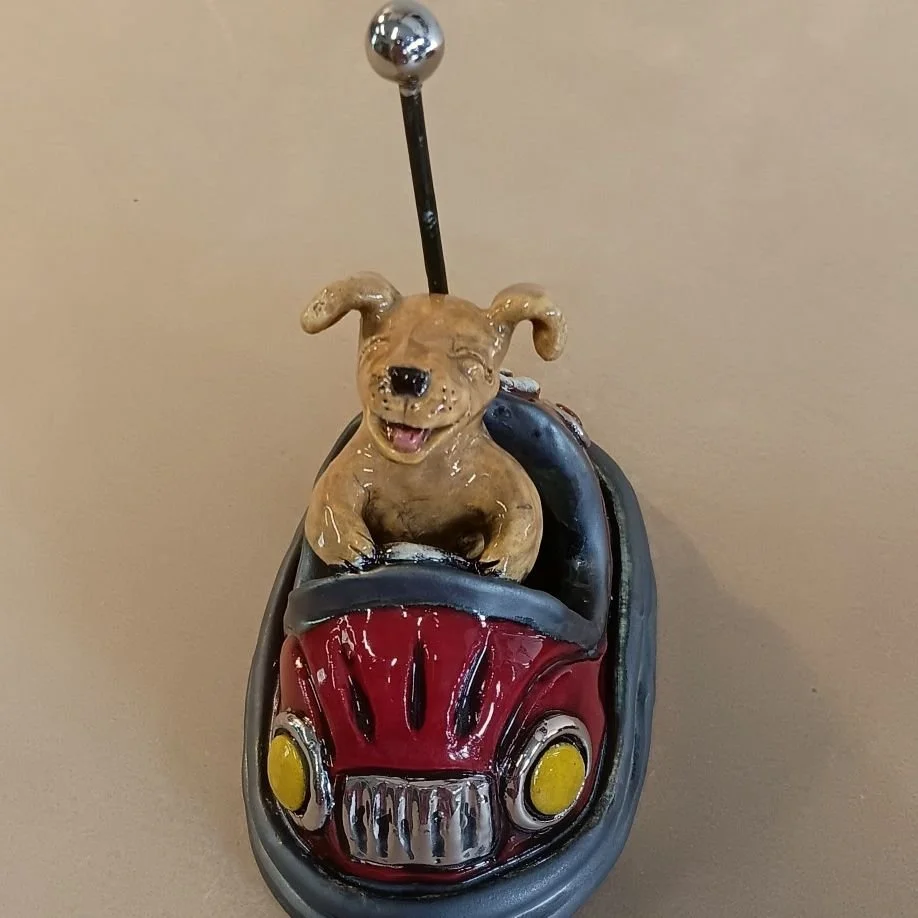 Bumper car dog, white earthenware clay, fired to cone 05, white gold luster