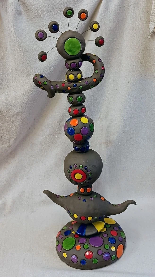 Stacked bead sculpture, black earthenware clay, fired to cone 05, 22 inches tall