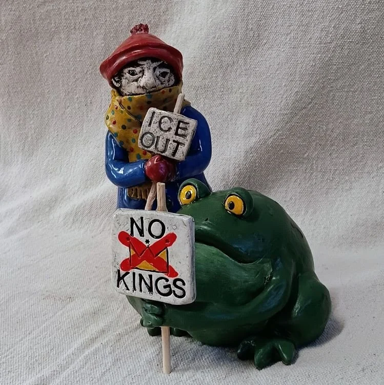 Frogs Together Strong protester, white earthenware clay, fired to cone 05
