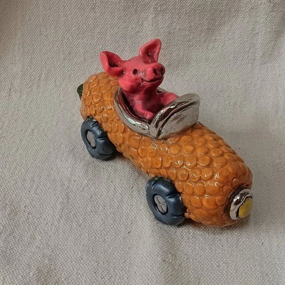 Richard Scarry corn car, white clay with platinum luster, fired to cone 05