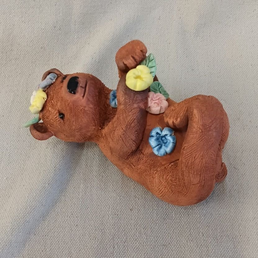 Bear in flowers, red and white earthenware clay, fired to cone 05