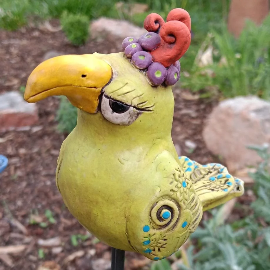 Chartreuse Glamour bird on a pole, white clay fired to cone 05