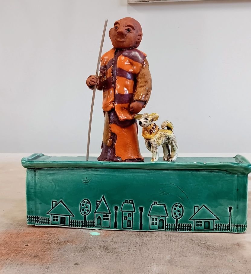 (sold) Walk for Peace monk and dog, red earthenware clay fired to cone 05