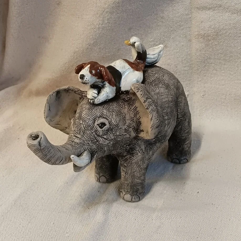 Elephant with dog and duck, grey and white earthenware clay fired to cone 05