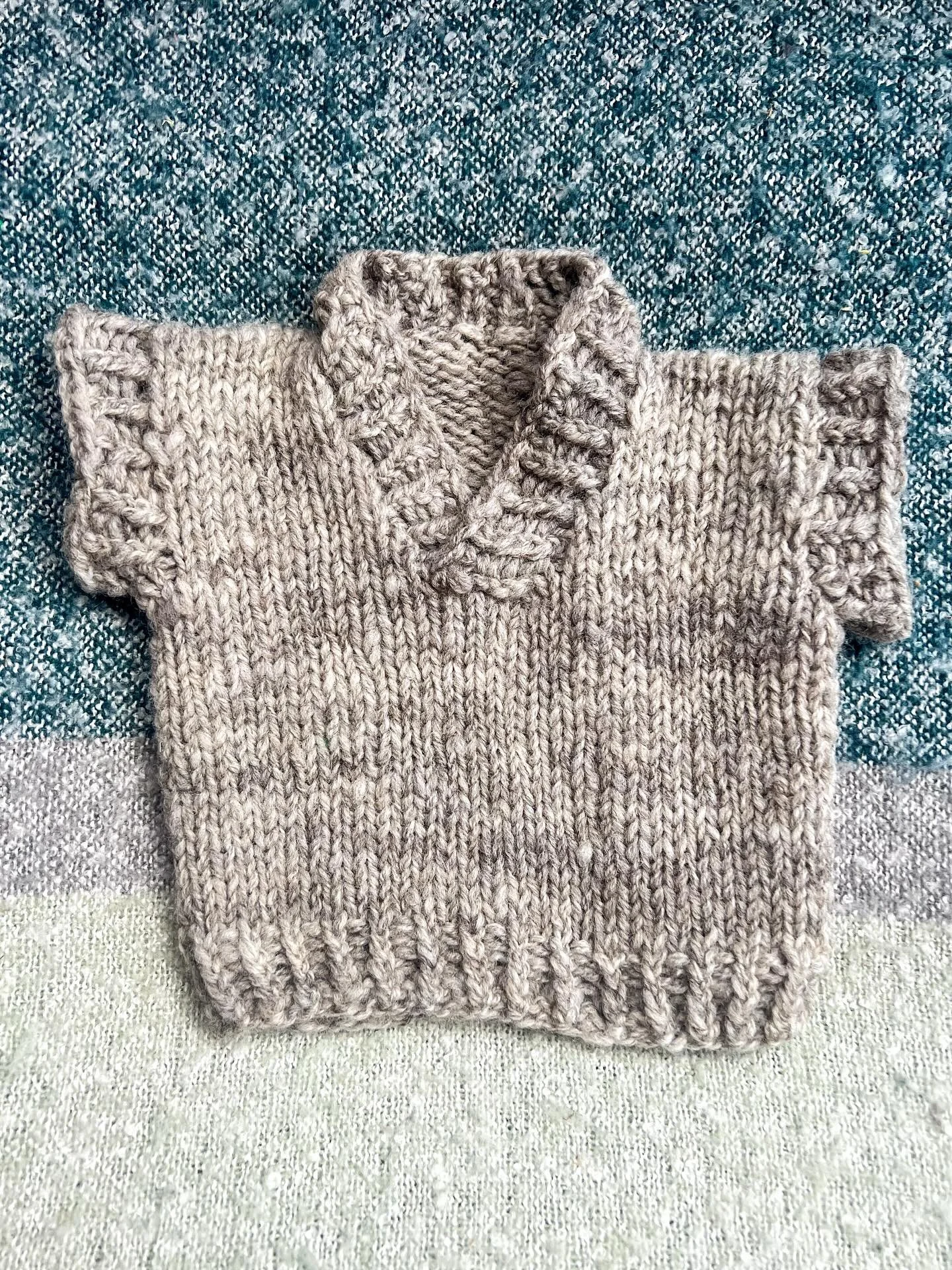 I spun the yarn for this sweater vest myself, and had been saving it for a very special project. When one of my oldest and best friends told me that she was pregnant, I knew straight away that this was that special project the yarn had being making s