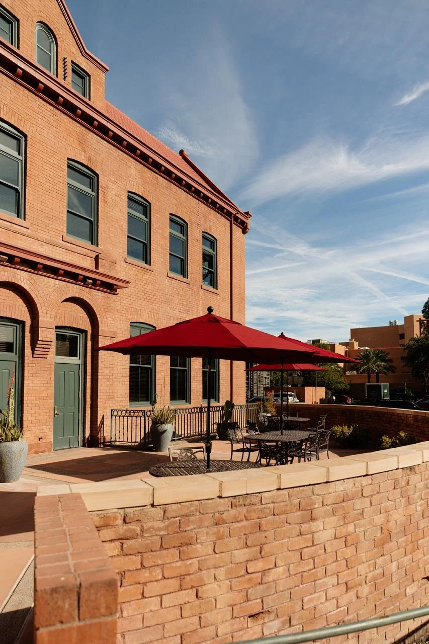 university-club-tempe-exterior-patio-red-umbrellas.jpg