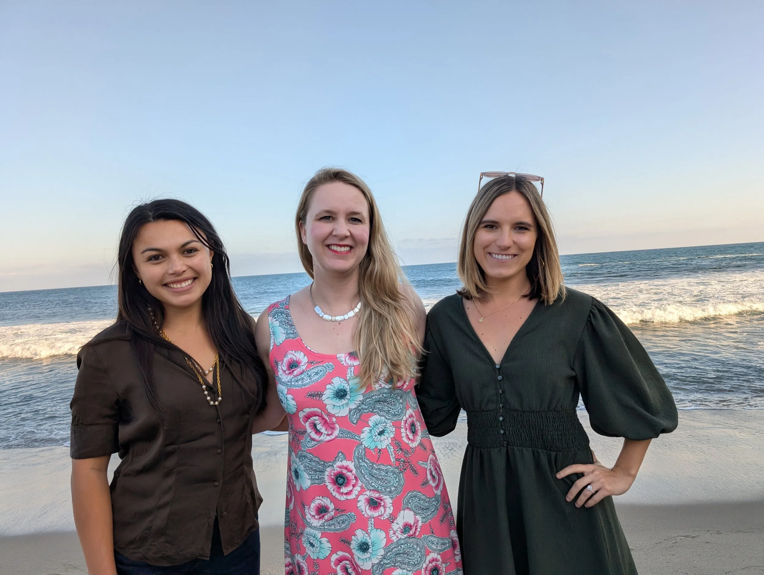 three emdr therapists linking arms on the beach in san francisco representing the start of grounded and integrative trauma therapy for people in the bay area