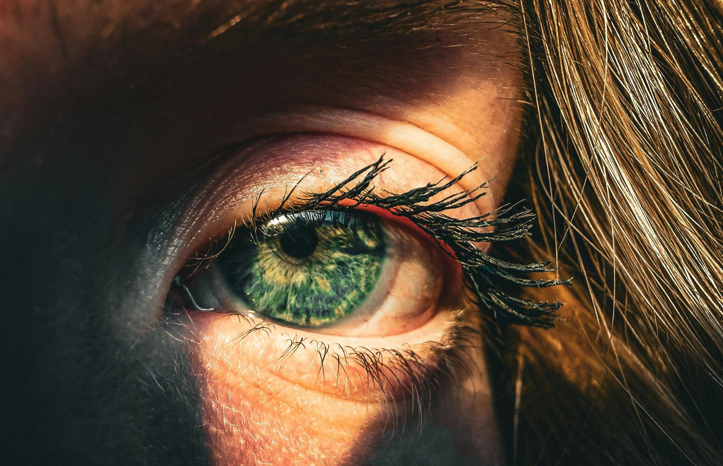 a closeup of someone's eye with mascara on the lashes, , representing the experience of EMDR therapy feeling worse before it gets better