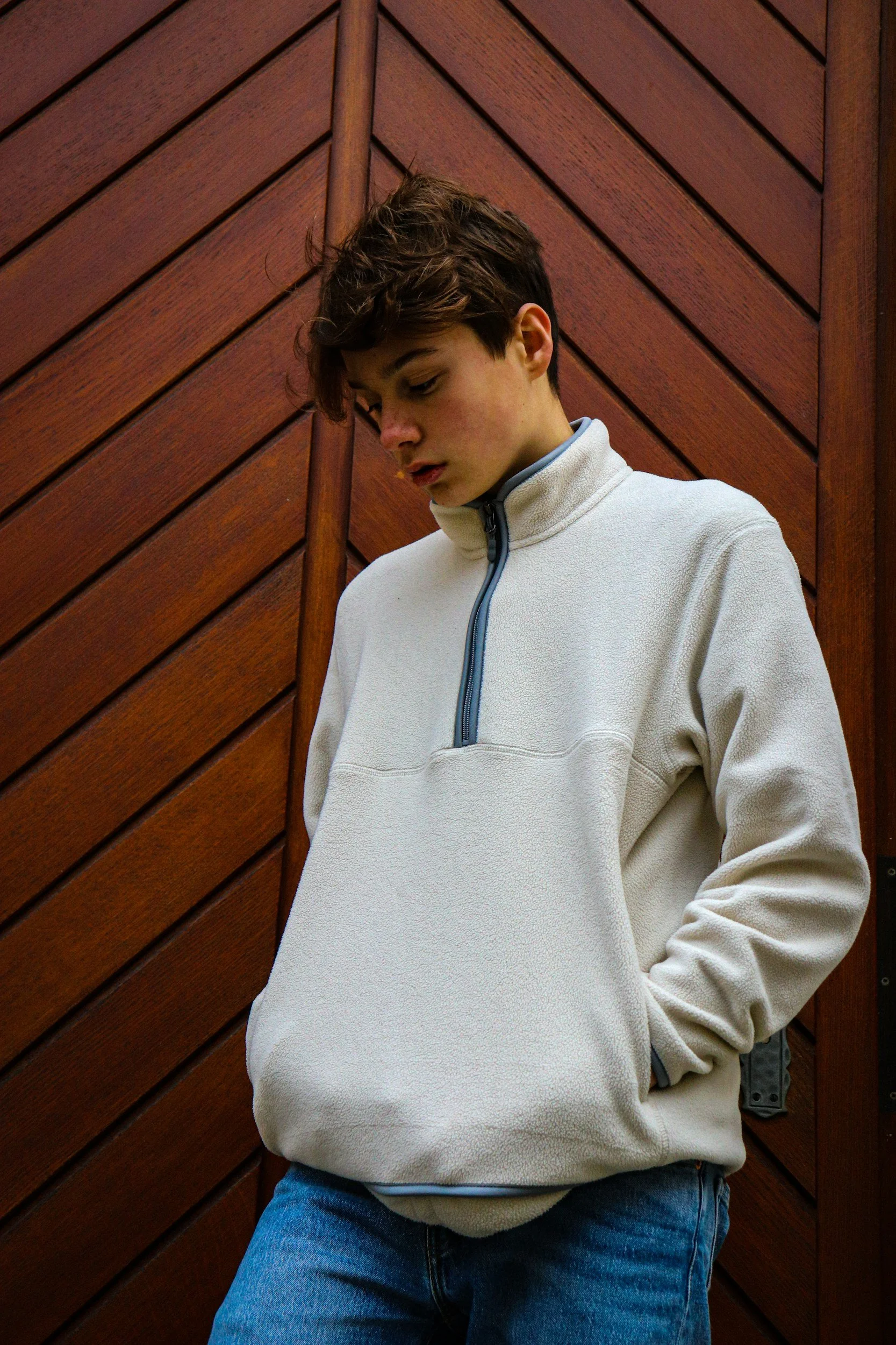 Teenager looking pensive, representing the mental health pressures teens are facing in 2026