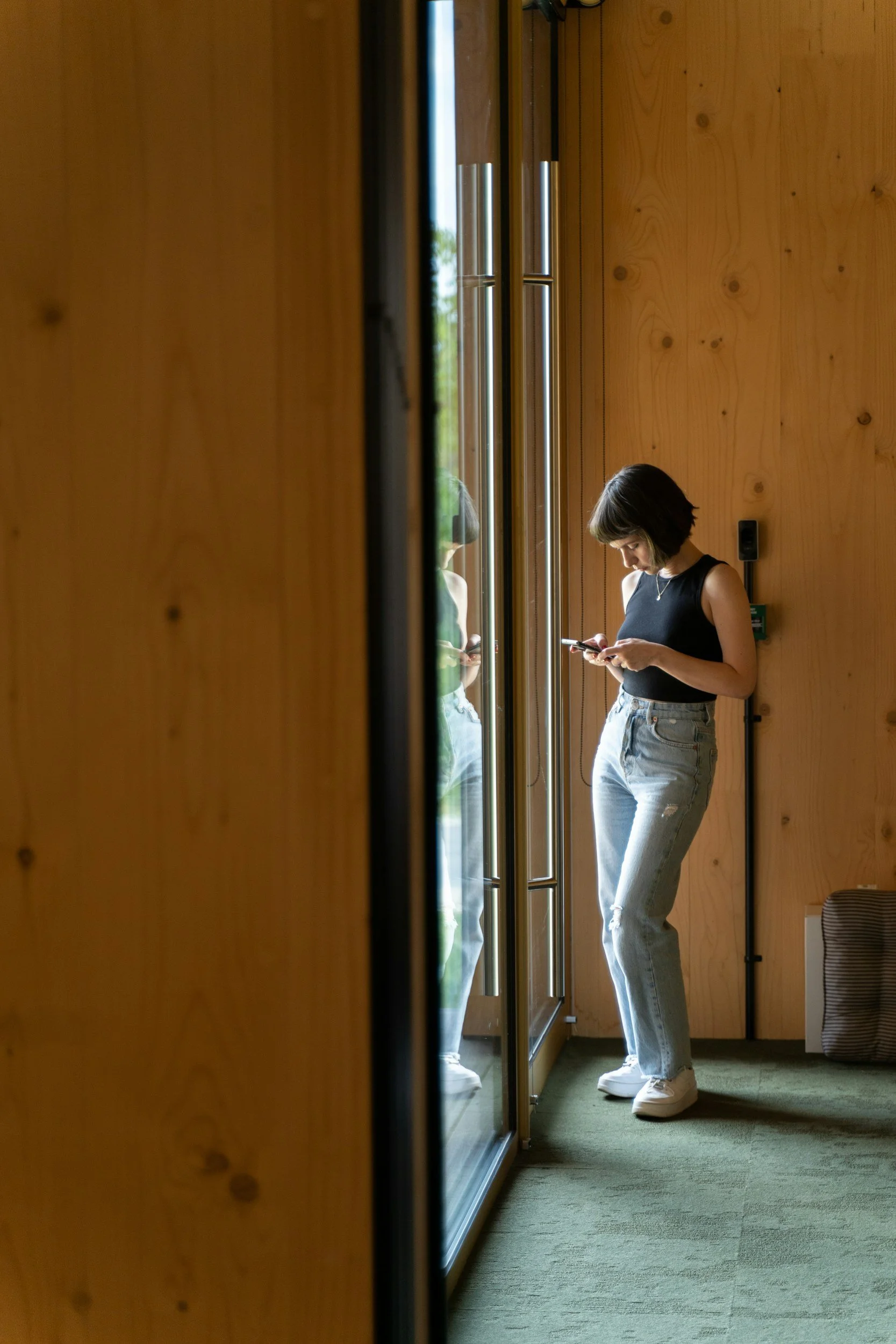 Teen participating in a teletherapy session from home