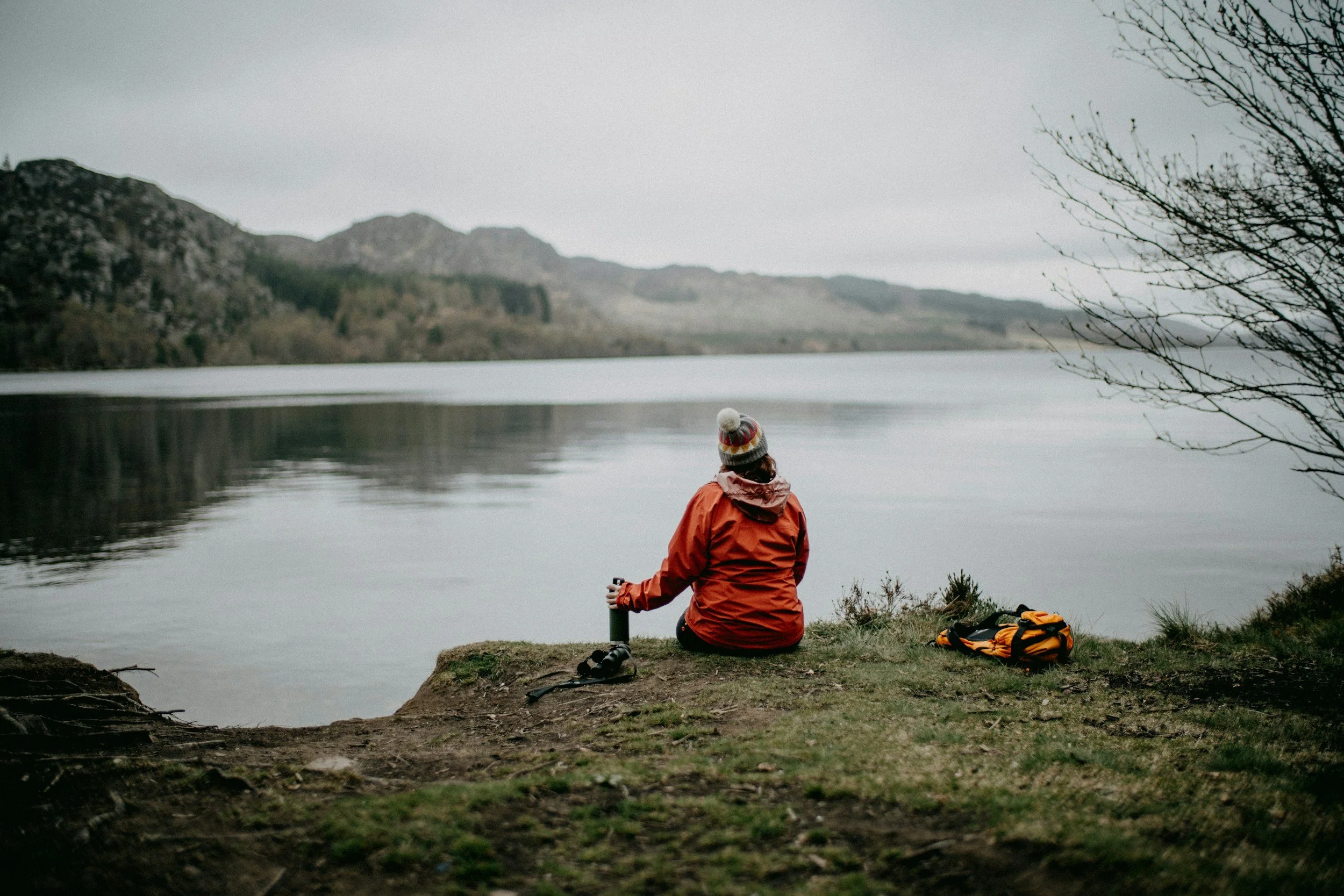 A woman appearing frozen and panicked during conflict, representing how unprocessed trauma triggers physiological flooding that insight alone cannot resolve