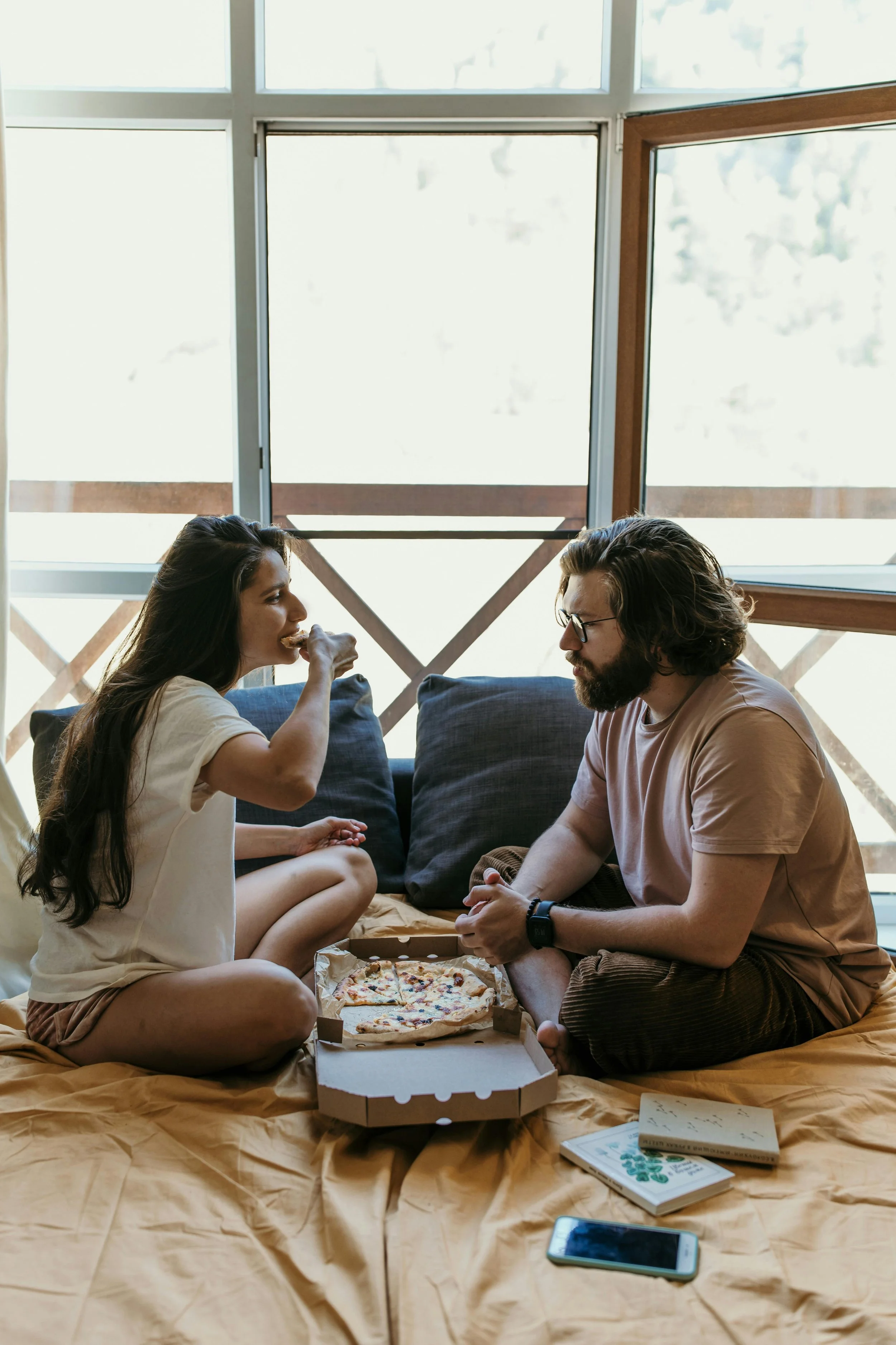 Couple laughing together on a date representing playful connection strategies recommended by couples therapists