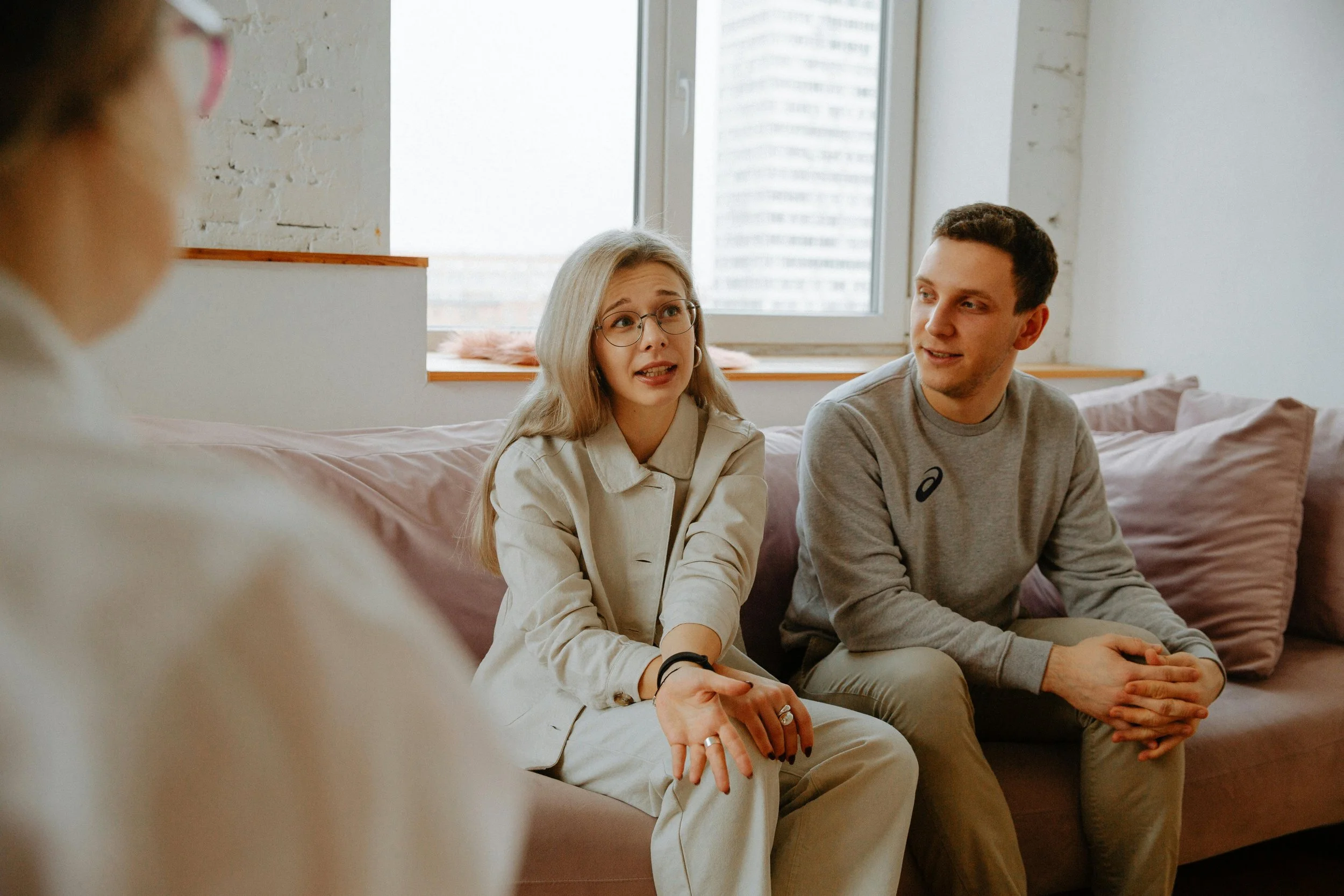 Couple in a serious conversation representing the difficult impasse of disagreeing on children in couples therapy in Los Angeles