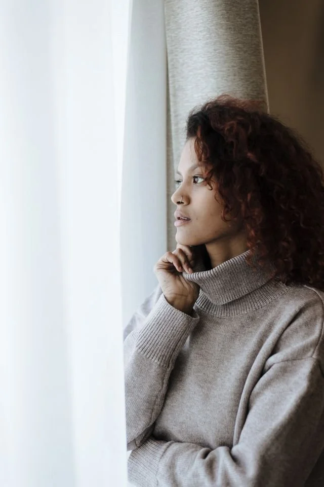 Person in a quiet moment of reflection representing identity grief and EMDR therapy support in California