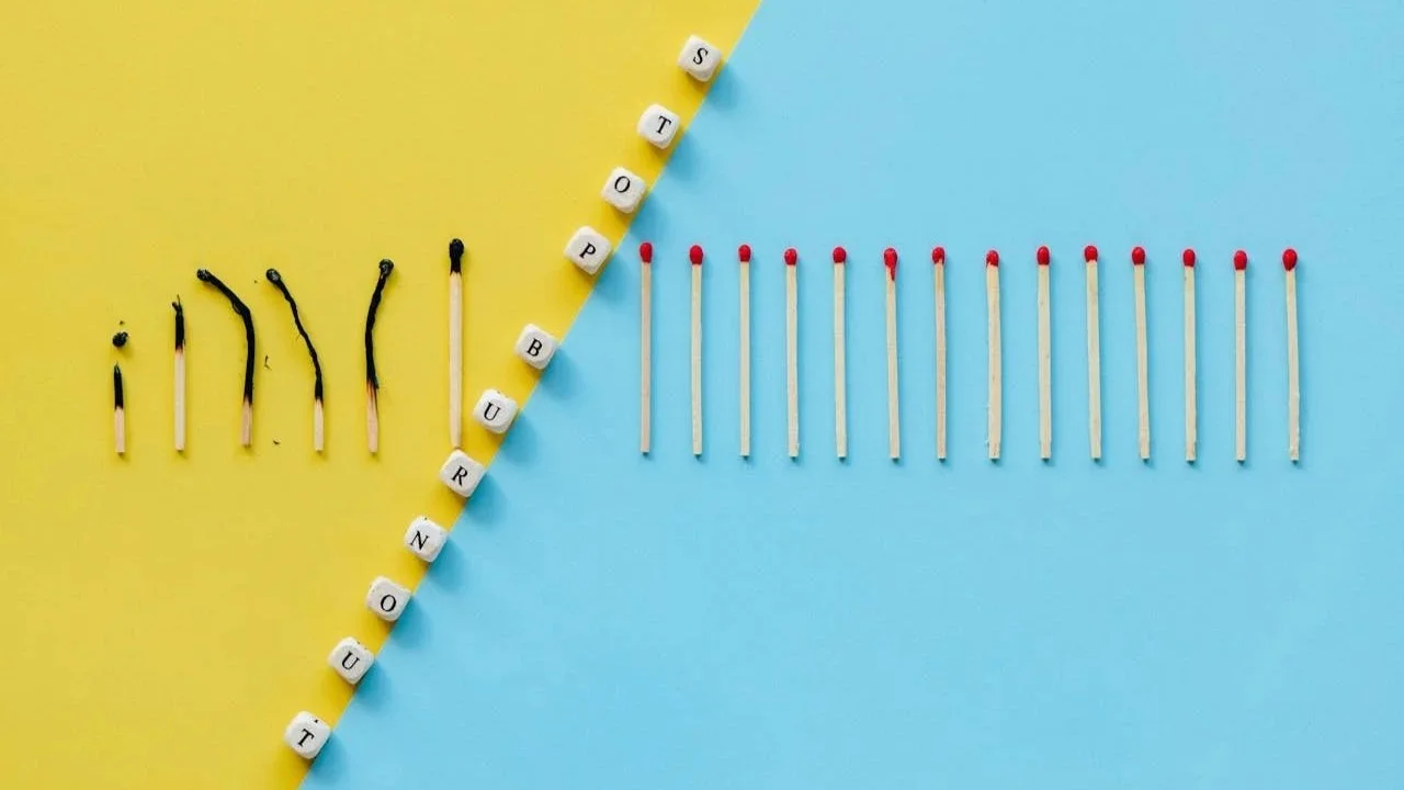 a line of matches half burned out with a line separating the burned ones from unburned ones representing the recovery work tech professionals do to address chronic stress and nervous system dysregulation