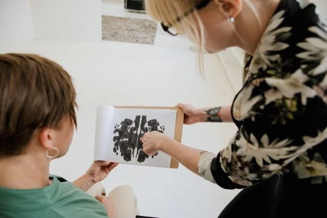 Person experiencing bilateral stimulation during an EMDR therapy session representing trauma healing