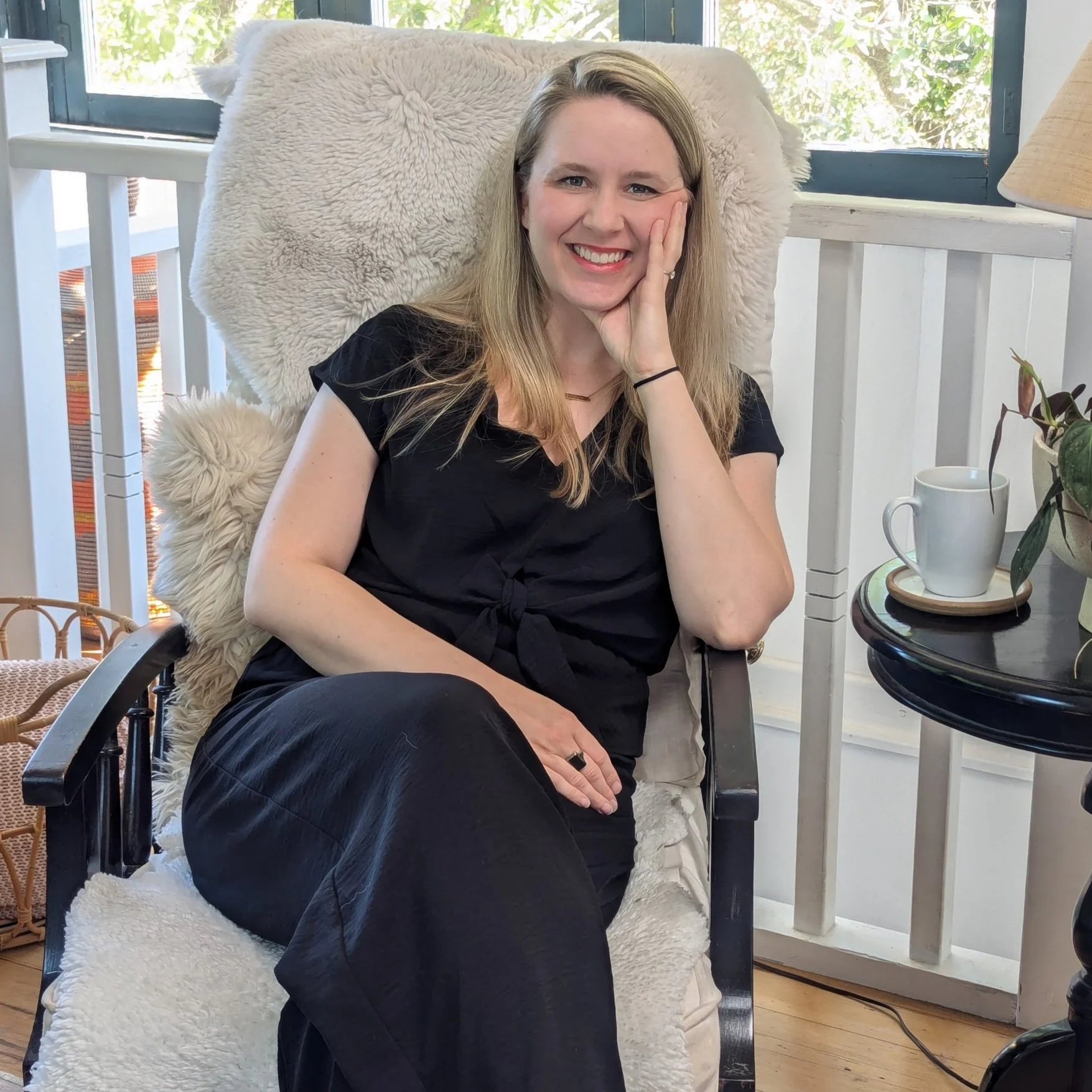 Laurel van der Toorn, licensed emdr therapist in los angeles, sit smiling in a comfortable chair