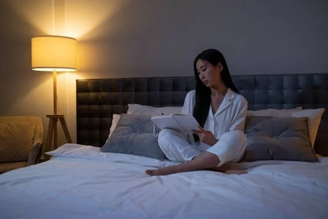 Person at home in the evening representing a dedicated emotional processing practice as part of burnout recovery