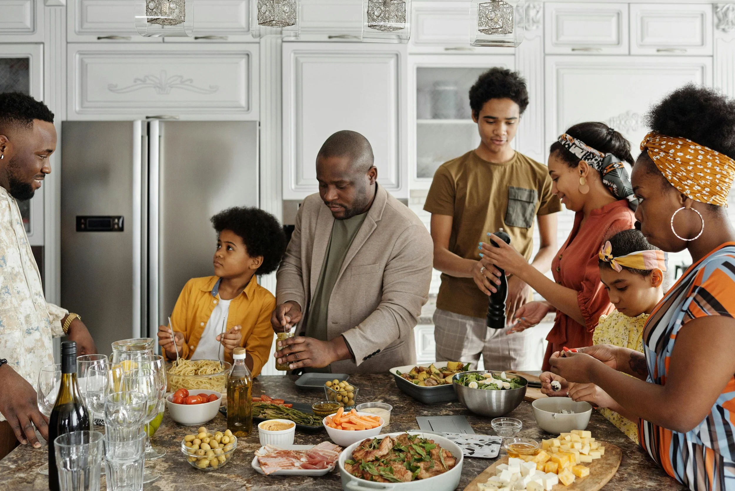 A family gathering with an undercurrent of tension, illustrating the subtle but destabilizing dynamic of passive-aggressive in-laws that couples therapy can help address