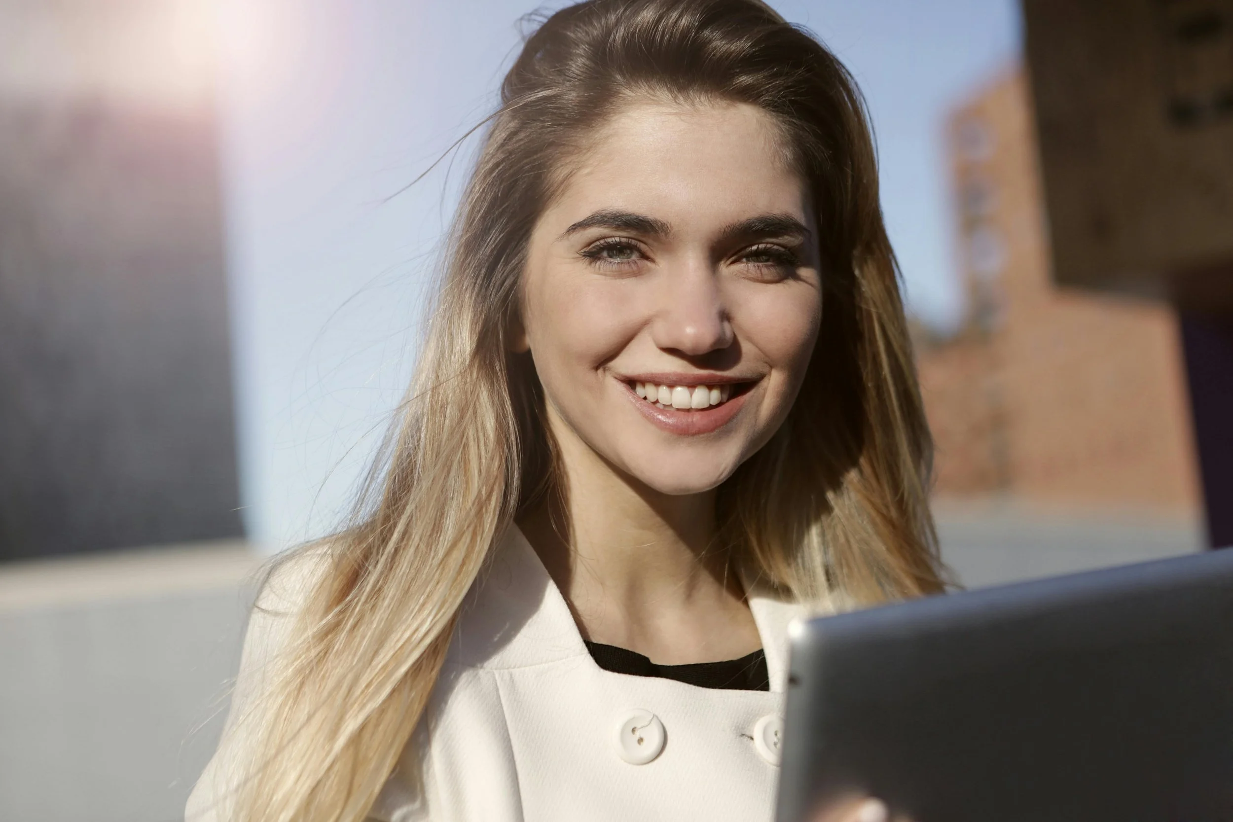 Smiling lawyer representing the relief from performance review anxiety that high-achieving legal professionals can find through therapy