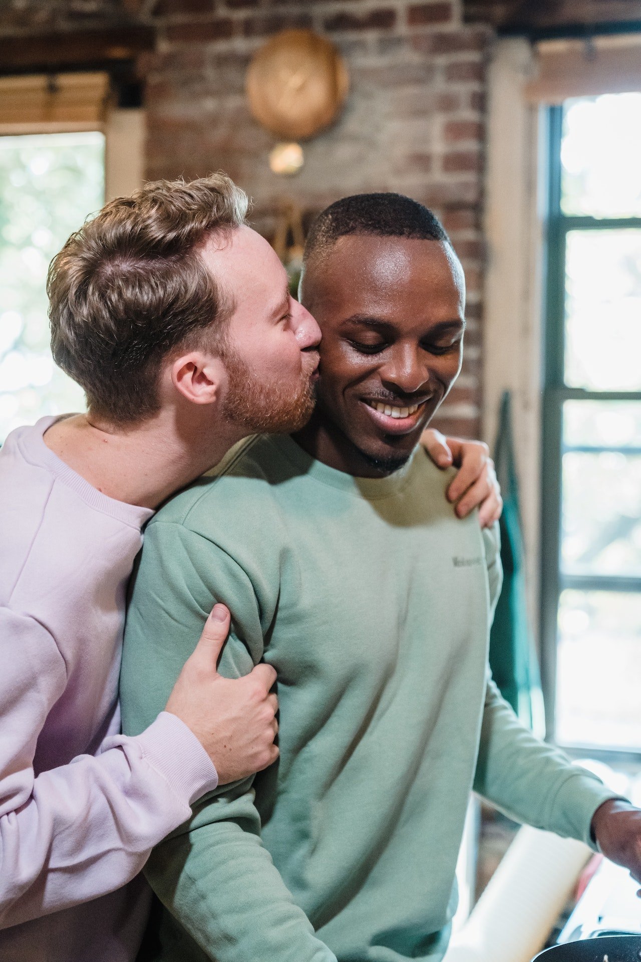 Two men in a warm embrace, representing couples therapy in San Francisco