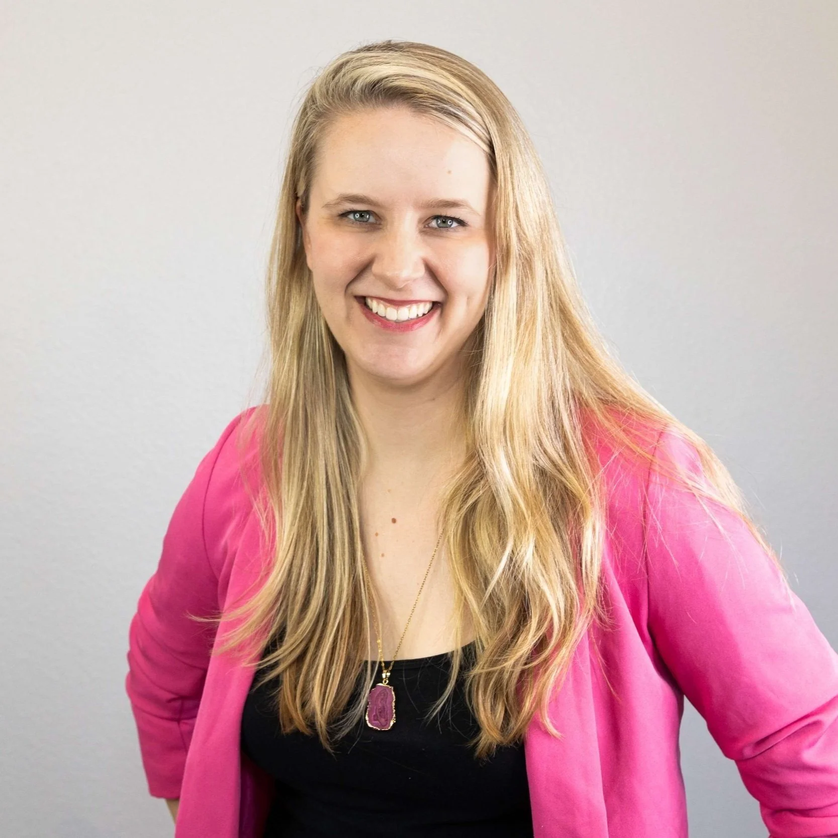 Laurel van der Toorn, LMFT, smiling in a pink top