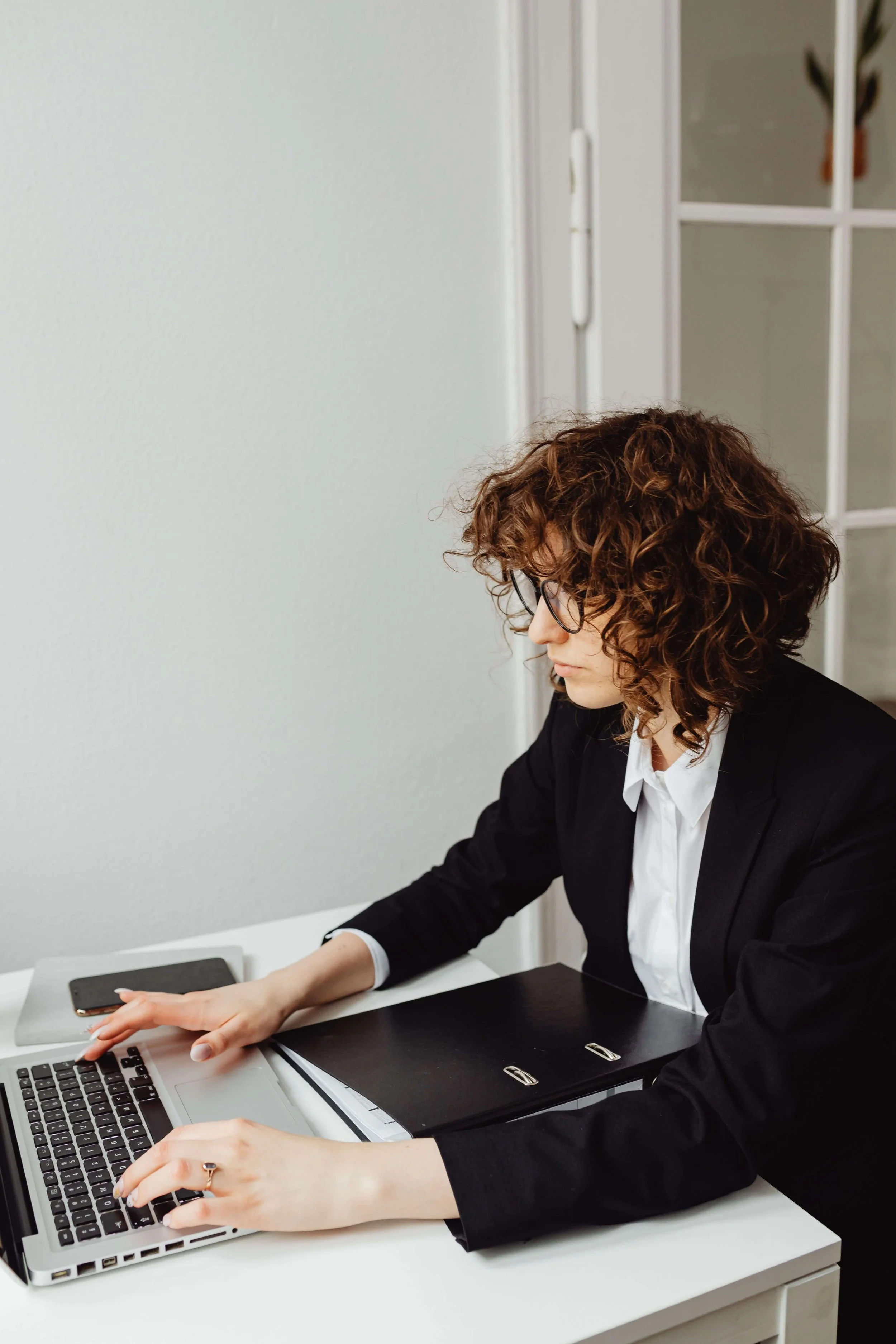 Professional composed at work representing emotional containment strategies for high achievers managing burnout