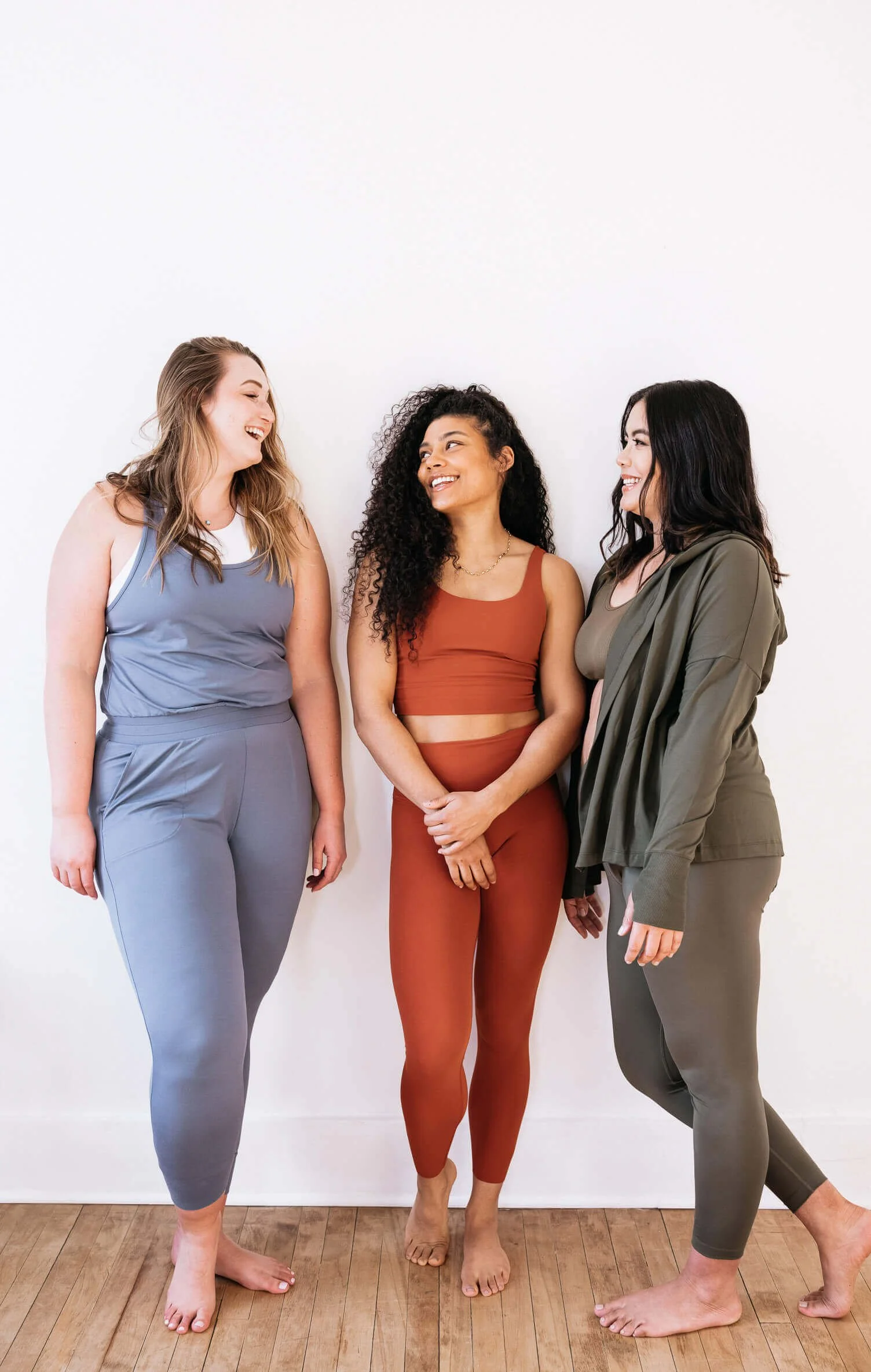 three women in athleisure working out together representing movement as a burnout prevention strategy