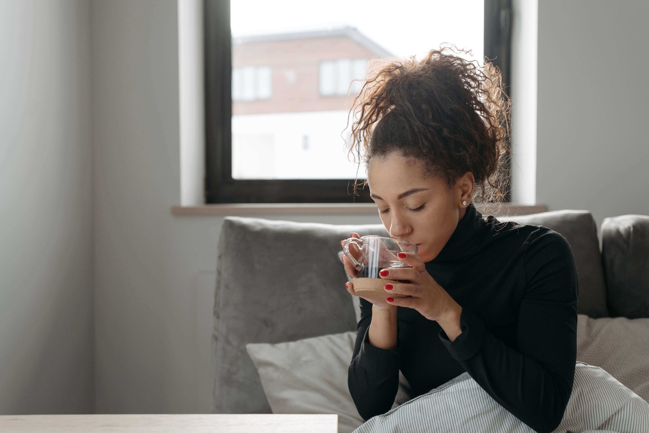 Person in a calm, softly lit room representing online EMDR therapy for trauma and anxiety in San Francisco and throughout California