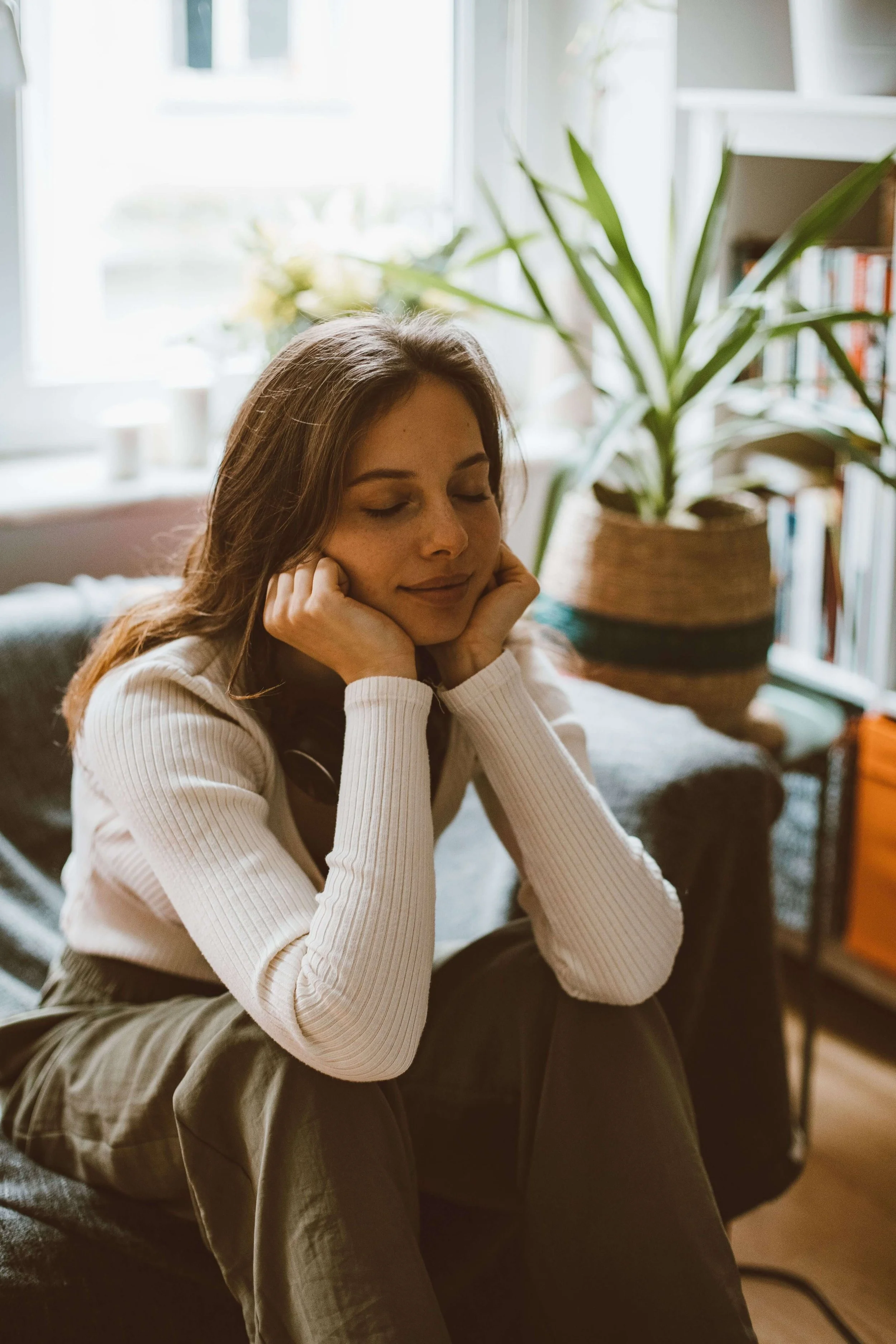 Person in a calm setting representing body awareness and internal cue recognition developed through holistic therapy in Los Angeles