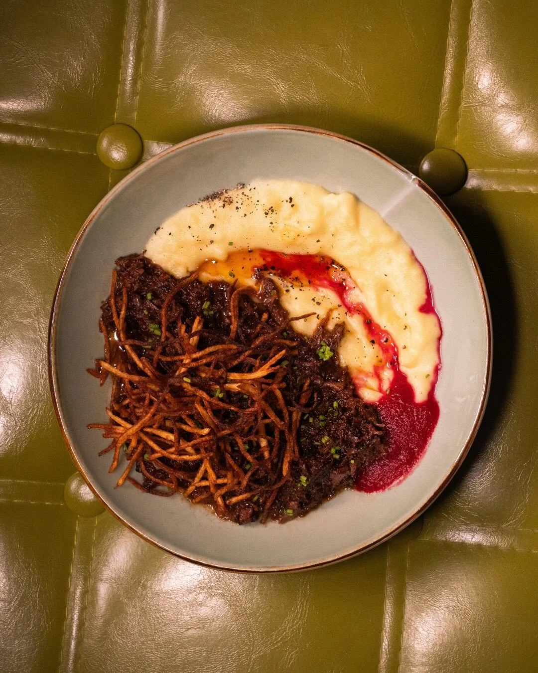 Cheeky Mother of Beef.

Dry-brined and slow-cooked beef cheek, finished with a beetroot reduction, buttery mash, beef jus, and chives.

Rich, tender, and built to be taken slow.