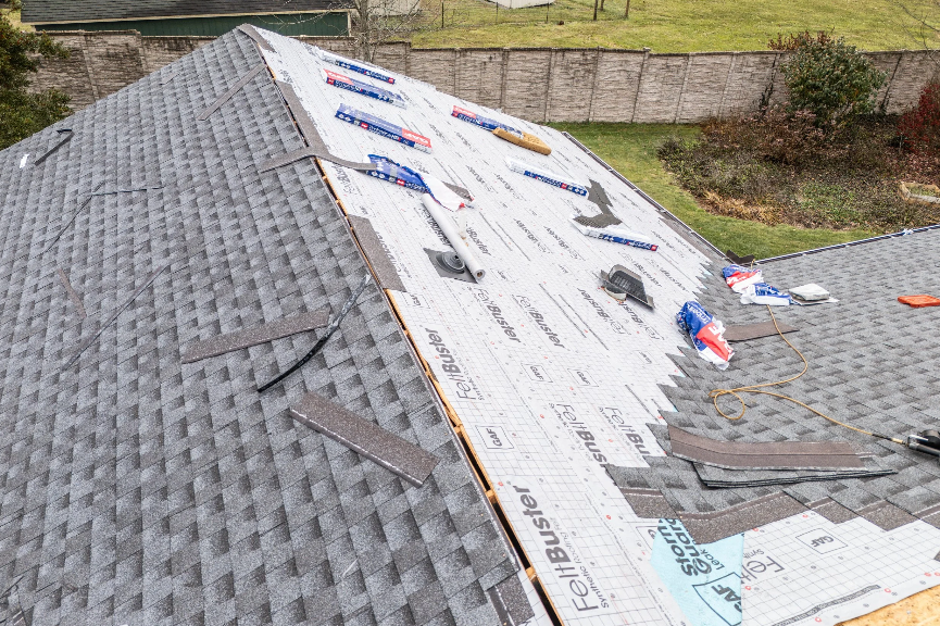 hail damage on asphalt roof shingles showing dents and granule loss