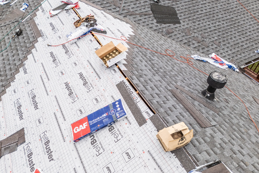 roof replacement project on residential home showing roofing installation cost factors